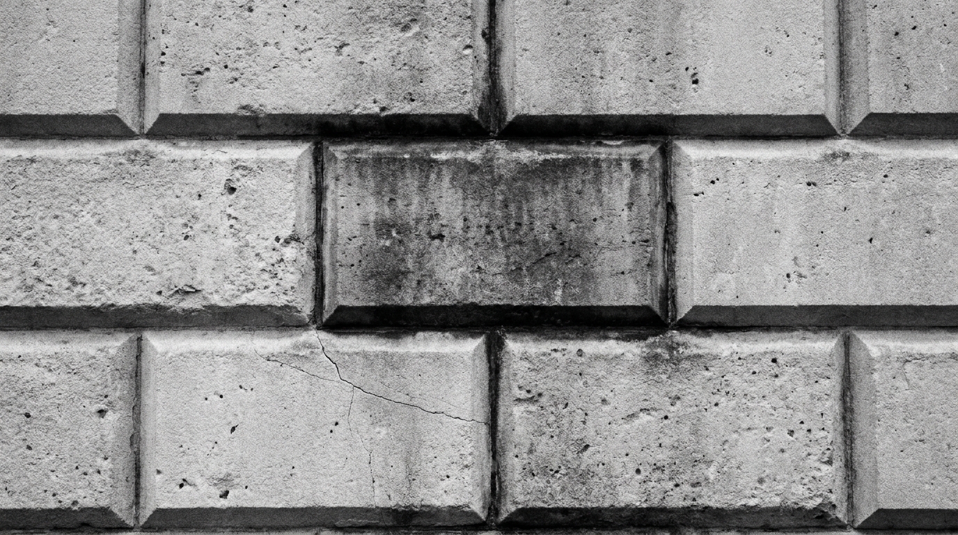 A rusticated ashlar course on an exchange facade, straight on.